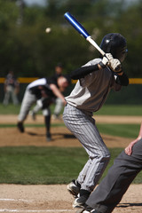 batter about to hit a pitch during a baseball game