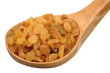Raisin in a wooden spoon on a white background