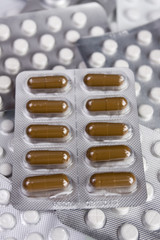 Packings of medical pills and tablets.