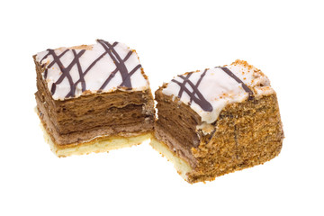 Two cakes with chocolate isolated on white