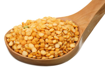 Dry peas in a wooden spoon