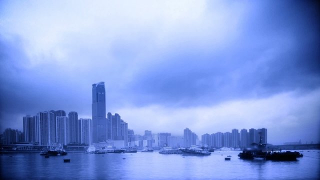 Timelpase Storm Clouds Cityscape, Hong Kong. (Duotone in blue)