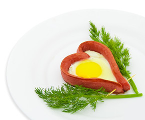 Fried sausage in the form of heart on a white background