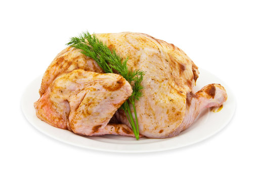The crude cut chicken on a white plate