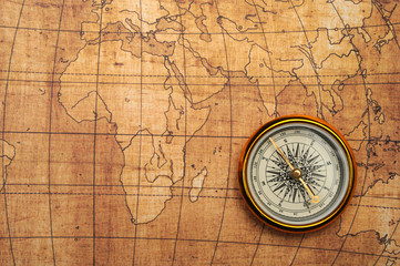 Fototapeta na wymiar Compass on old map.
