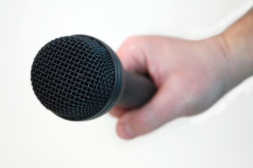Hand with a microphone