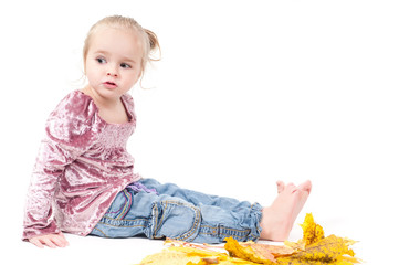 Toddler with maple leaves