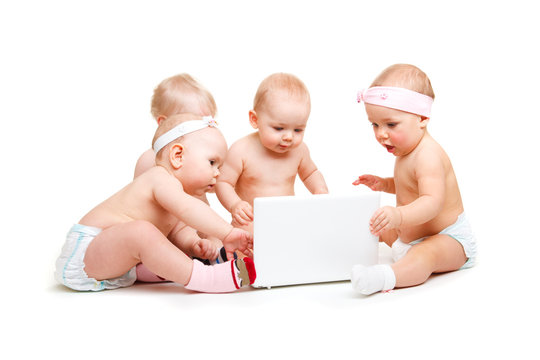 Babies working at laptop