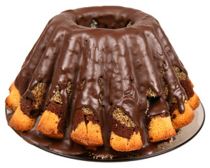 Bundt Cake covered with chocolate isolated on white