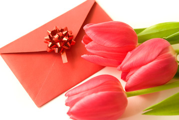 Red envelope and red tulips