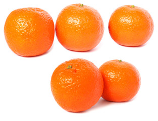 five ripe clementines isolated on a white back