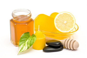 bar of glycerin soap, jar of honey and lemon