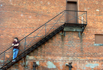 Against rustic brick wall