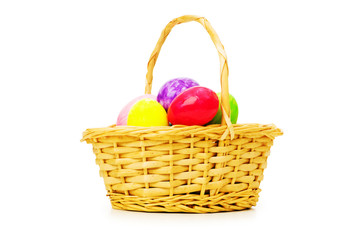 Easter concept with eggs and basket on white