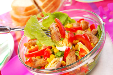 fresh salad with breaded meat and vegetables