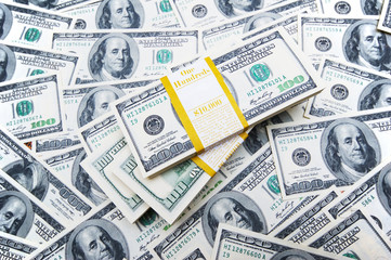 Fototapeta na wymiar Stack of dollars on money background