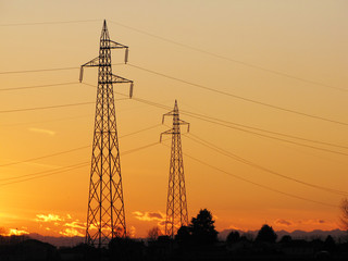 electric tower silhouette for during sunset