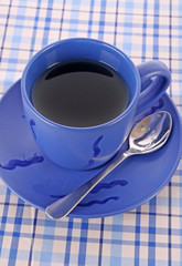 Blue cup of tea on the the table