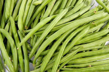 raw long green beans in closeup