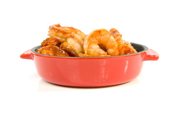 little casserole with shrimp over white background