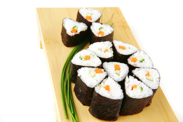 rolls of sushi on wood