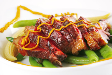 meat served on white with mustard