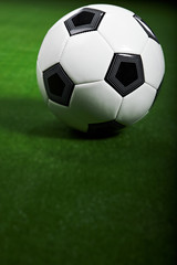 Fototapeta premium Soccer ball on green grass