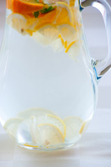 Pitcher with water and fruits