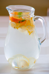 Pitcher with water and fruits