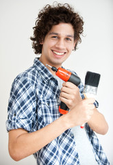 Boy with Electric Screwdriver and Paintbrush