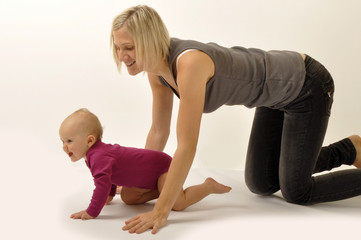 Fototapeta na wymiar Mother crawling with baby