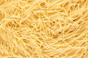 Heap of yellow noodles. As background.