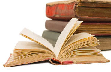 Pile of old books on white background