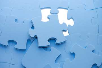 Obraz premium Dropped out part of a blue puzzle