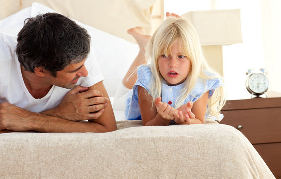 Little Girl Talking Seriously With Her Father