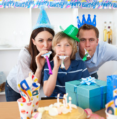 Jolly parents celebrating their son's birthday