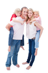 Attentive parents giving their children piggyback ride