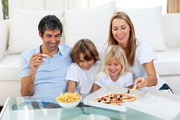 Positive family eating pizzas