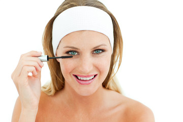 Fototapeta premium Attractive woman putting mascara
