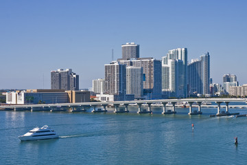 Obraz na płótnie Canvas Luxury Yacht Leaving Miami Harbor