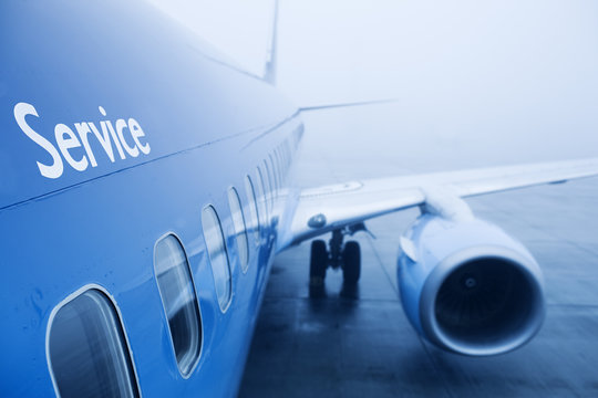 boeing airplaine exterior close up, fog