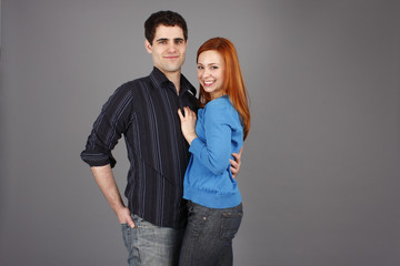 Happy young couple in casual clothes.