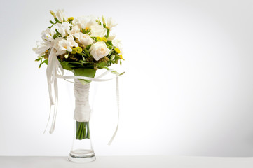 wedding bouquet in vase on a white background with vignette