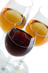 Glasses with white and red wine on a white background