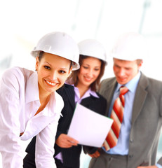 A group of architects discussing the plans for a new building.
