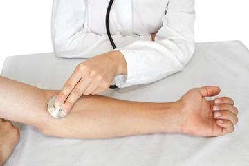 doctor measures pulse