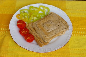 Toast with small tomatoes and pepper