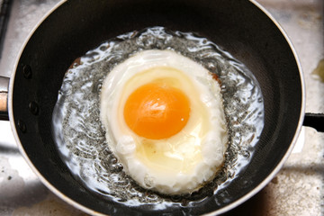 beautiful and tasty Fried egg in a frying pan