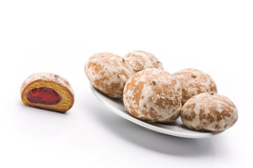 Pile of honey-cakes close up shoot over white background