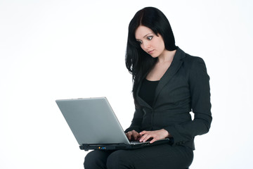 young businesswoman with laptop on white